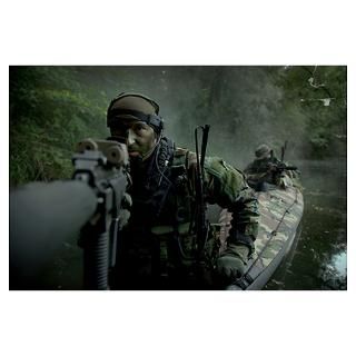 Navy SEALs navigate the waters in a folding kayak Poster