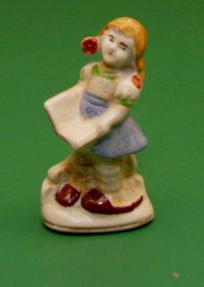 Occupied Japan Figurine Girl Child Book or Hymnal Rock Wall Old Red