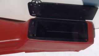 This is an original red 4 speed console for 1974 to 1981 Camaro.